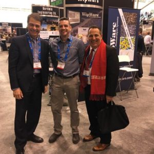 Anthony Rota and Marty Wanner and other person posing at NOMS Showcase PDAC 2018
