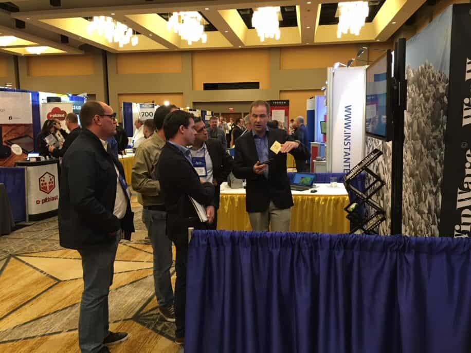 Thomas discusses fragmentation analysis with ISEE Explosives and Blasting Attendees at WipWare booth