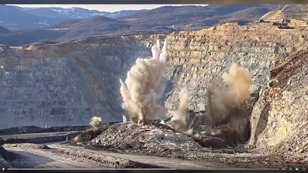 Blasted rock flying into the air Drilling and blasting