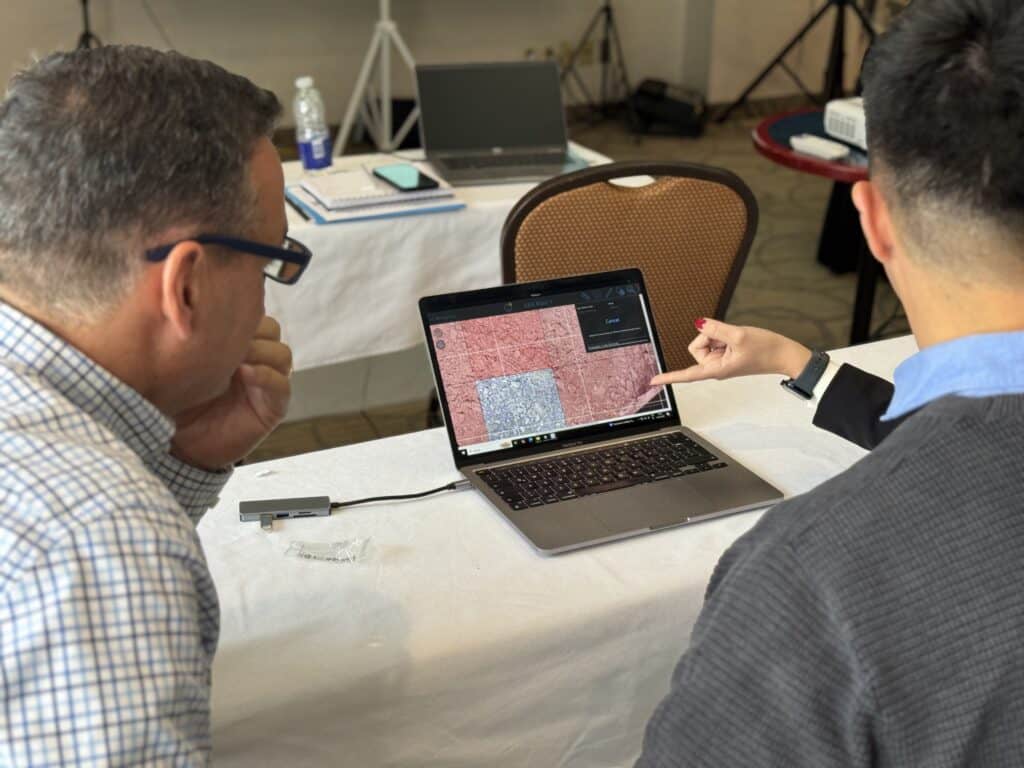 WipCon 2025 international reseller conference attendees in Montréal looking at WipWare analysis results